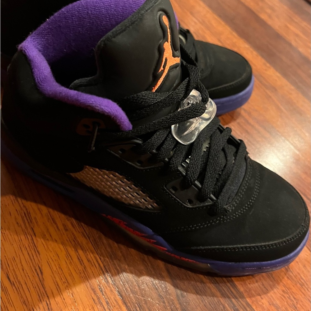 Jordan Raptor Black and Purple Sneakers with Iconic Logo